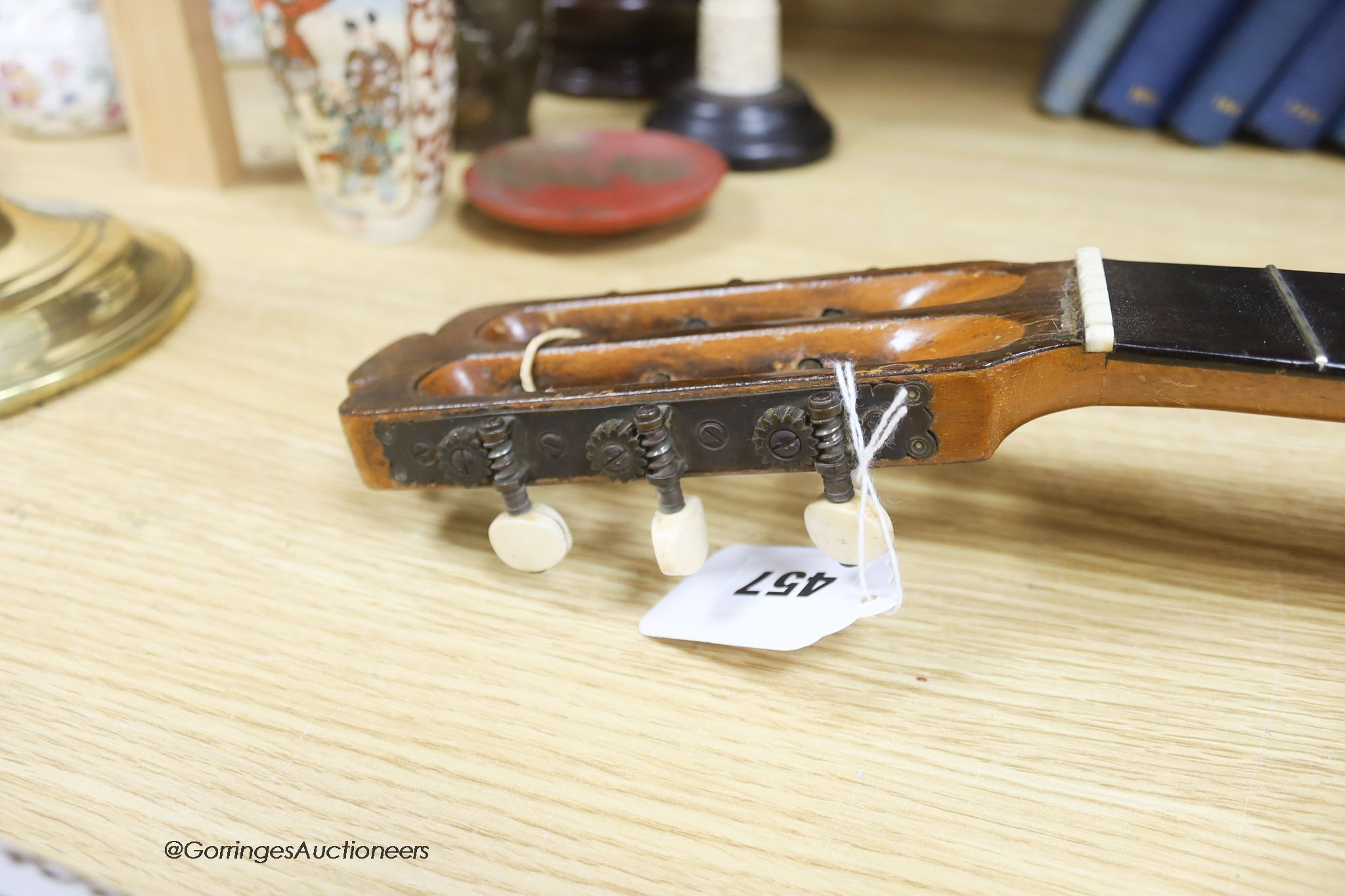 A Mexican mother of pearl inlaid acoustic guitar (no strings)